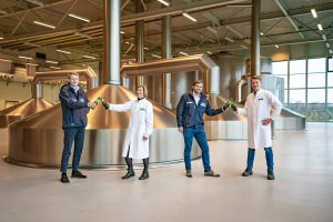 Jelle Klein Teeselink, managing director Host); Susan Ladrak, sustainability manager, Grolsch; Ben Olde Keizer, area sales manager, Host;, Danïel Platvoet, utility manager Grolsch, in the Grolsch brewery