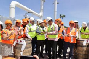 Edwin Zayas, VP of operations Bacardi Corporation (centre left) with Puerto Rico Governor Pedro Pierluisi (centre right) at the ribbon cutting ceremony for a new CHP system at the Bacardi distillery in Puerto Rico